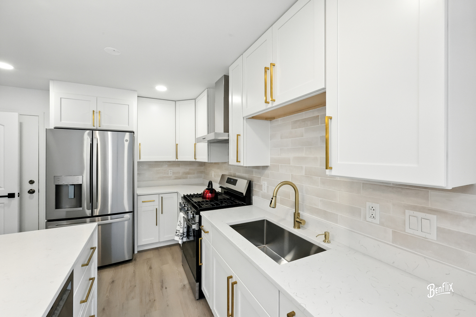 318 Exmoor Drive Streamwood, IL 60107 - Photo 8 of 26 a kitchen with stainless steel appliances a sink stove and refrigerator