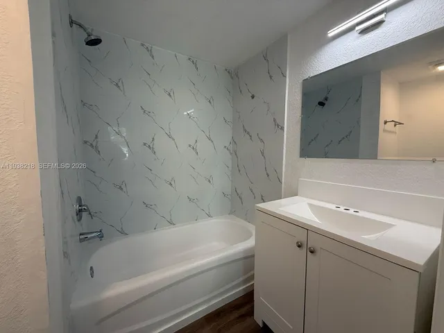 a bathroom with a sink and a bathtub