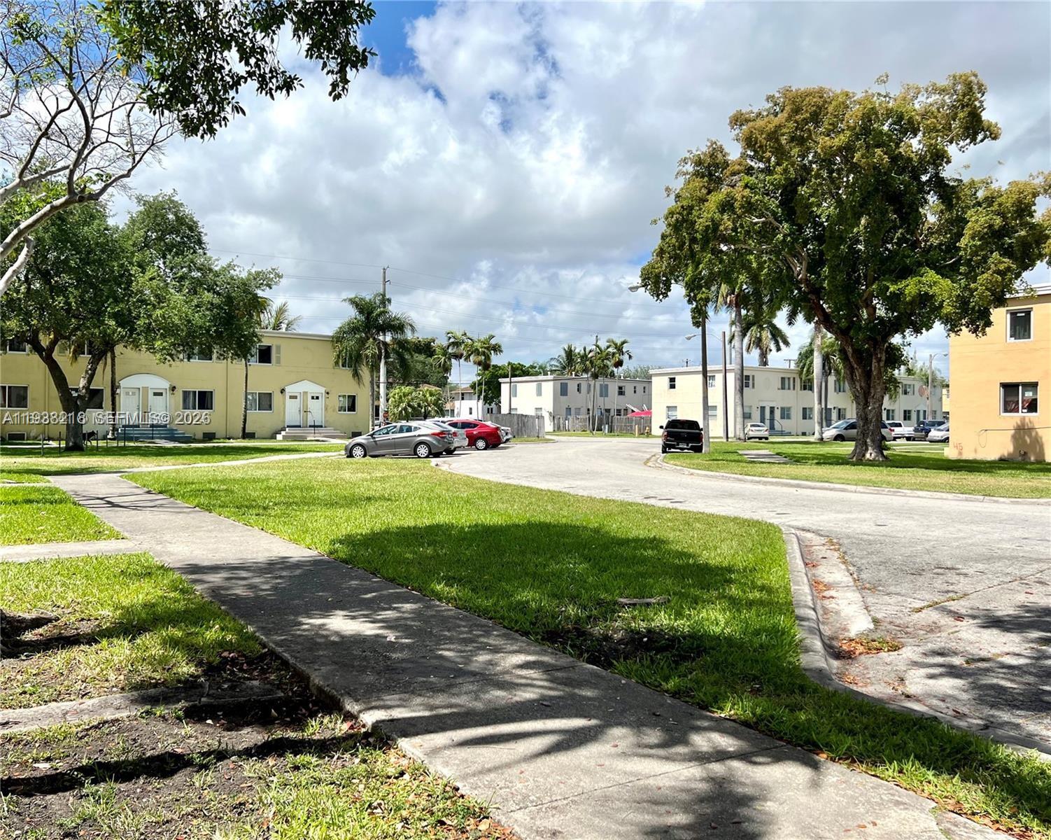 424 Northwest 84th Street, Unit 424 Miami, FL 33150 - Photo 15 of 15 a view of a park with large trees