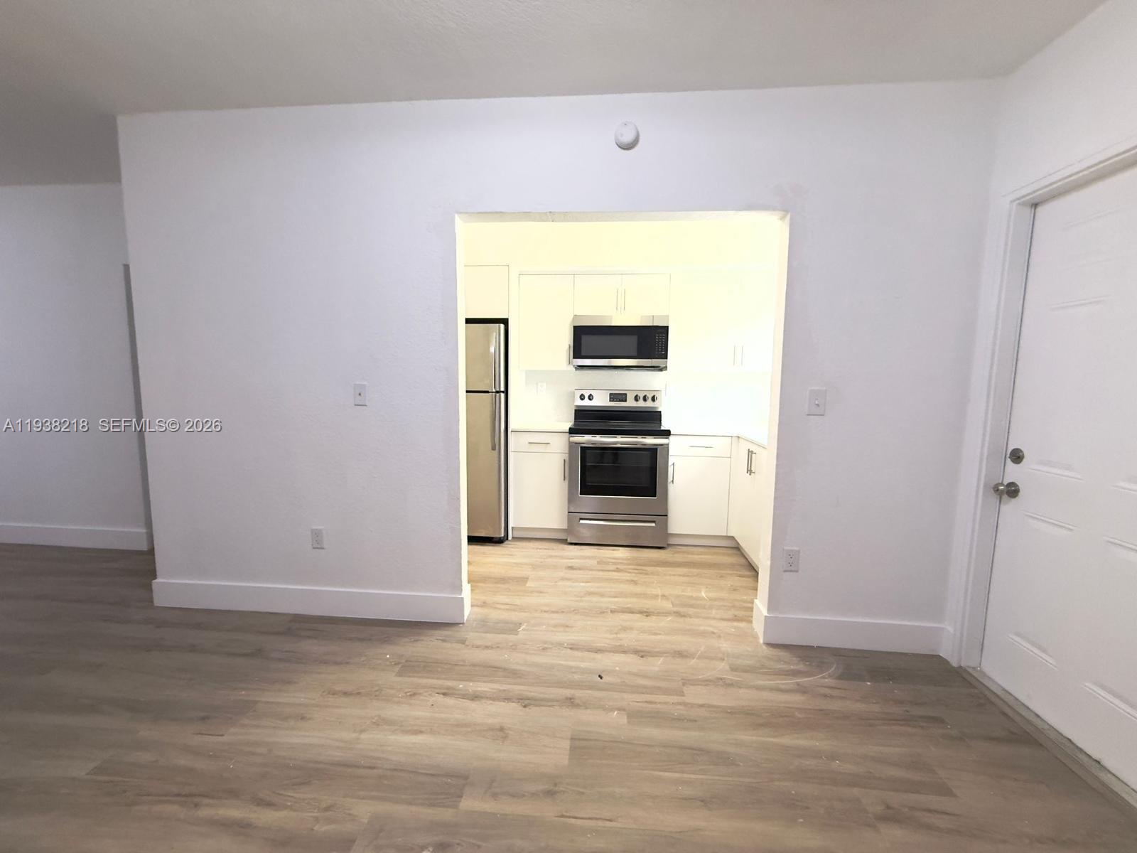 424 Northwest 84th Street, Unit 424 Miami, FL 33150 - Photo 4 of 15 a view of a kitchen with a sink and an oven