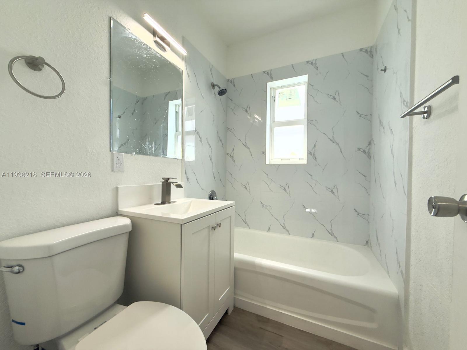 424 Northwest 84th Street, Unit 424 Miami, FL 33150 - Photo 8 of 15 a bathroom with a sink toilet and shower