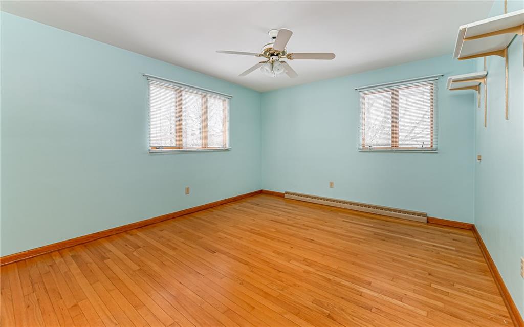 830 Hartzell School Road New Brighton, PA 15066 - Photo 15 of 31 a view of a room with wooden floor and a chandelier fan