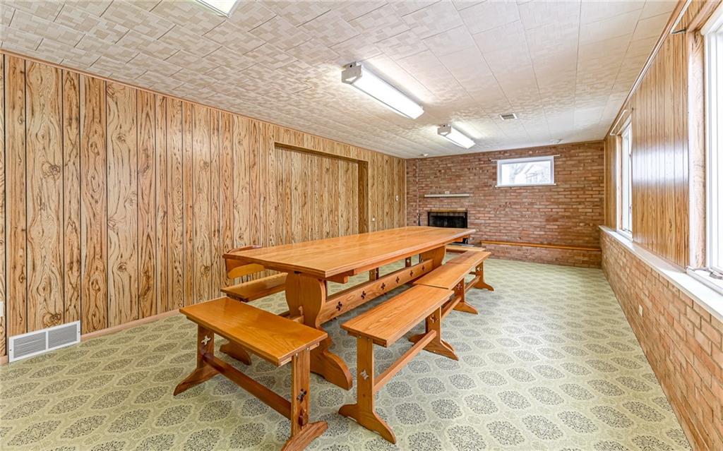 830 Hartzell School Road New Brighton, PA 15066 - Photo 19 of 31 a room with a table and chairs