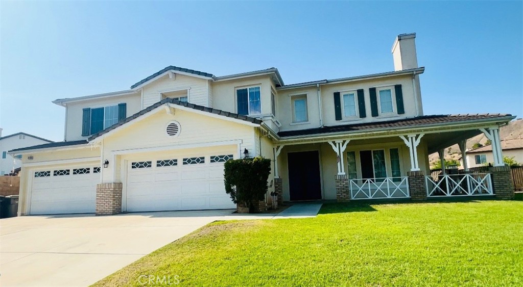 11130 Dufferin Avenue Riverside, CA 92503 - Photo 1 of 1 a front view of a house with a garden