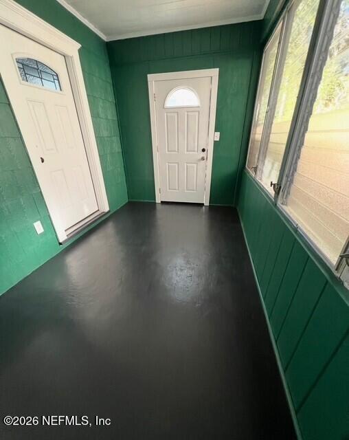 7307 Clinton Street Jacksonville, FL 32208 - Photo 5 of 17 a view of a small space with wooden floor and a window