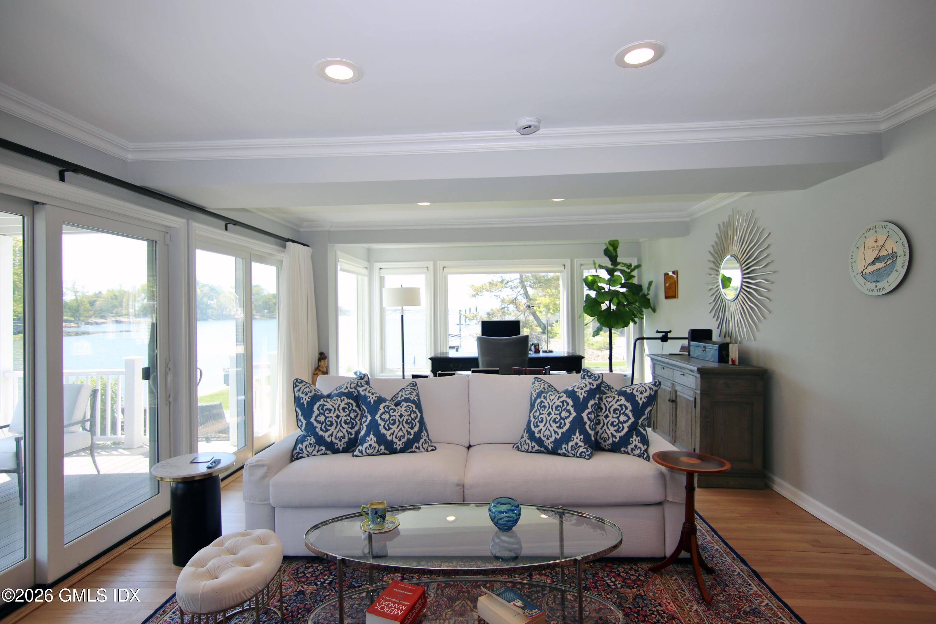 633 Steamboat Road, Unit 5 Greenwich, CT 06830 - Photo 9 of 29 a living room with furniture and a large window