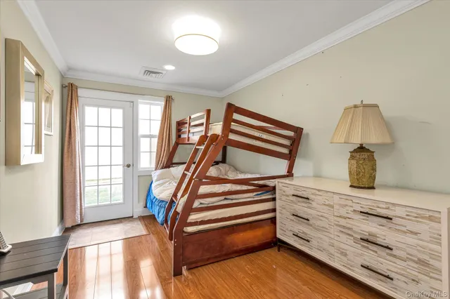 a bathroom with a granite countertop sink and a toilet