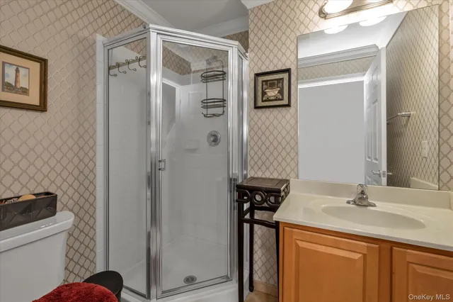 a view of empty room with stairs and wooden floor