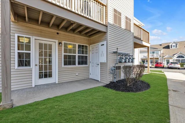 a view of a house with a garden and plants