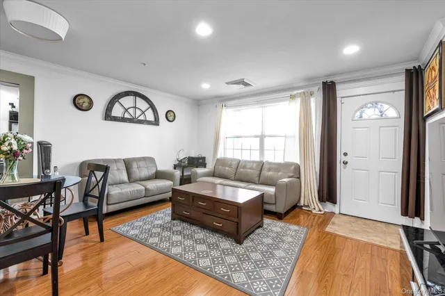 a living room with furniture and a rug