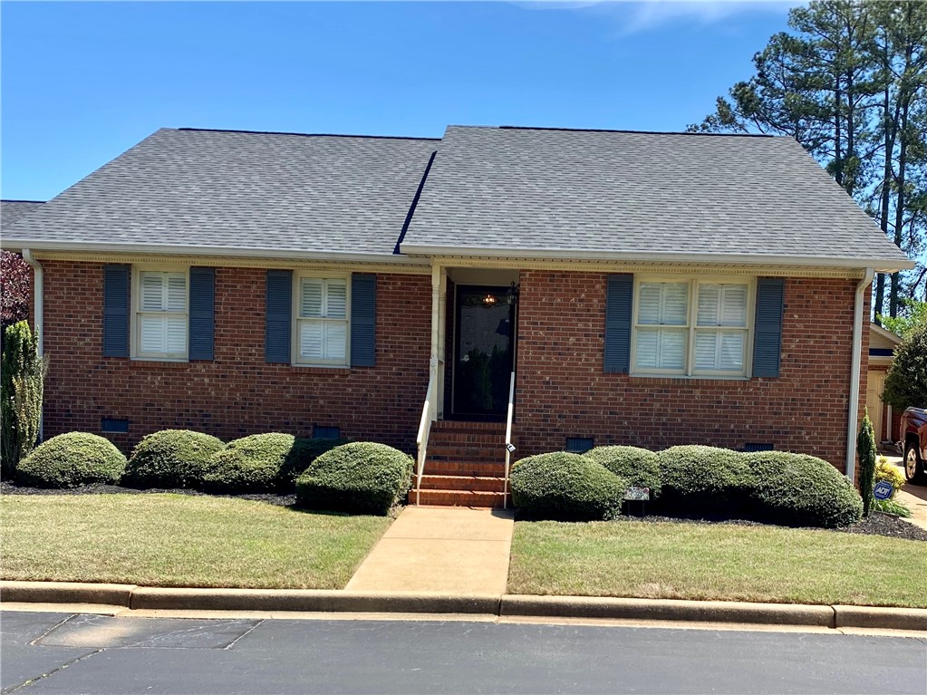 2026 Cardinal Park Drive Anderson, SC 29621 - Photo 2 of 41 This charming brick residence offers a warm welcome with a well-maintained front yard.