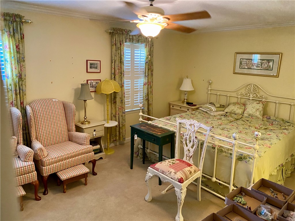 2026 Cardinal Park Drive Anderson, SC 29621 - Photo 28 of 41 This cozy bedroom features comfortable carpeting and elegant window shutters.
