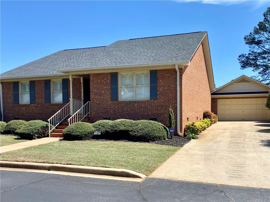 2026 Cardinal Park Drive Anderson, SC 29621 - Photo 3 of 41 This classic brick residence features a pristine front lawn, a welcoming entryway, and a convenient attached garage.