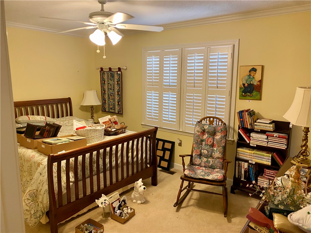 2026 Cardinal Park Drive Anderson, SC 29621 - Photo 35 of 41 This cozy bedroom features warm lighting and a classic aesthetic, perfect for quiet retreats.