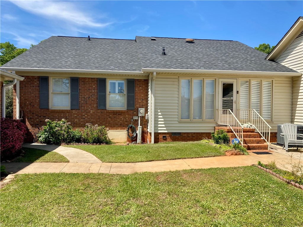 2026 Cardinal Park Drive Anderson, SC 29621 - Photo 5 of 41 This charming home features classic brick and siding, complemented by a neatly landscaped yard.