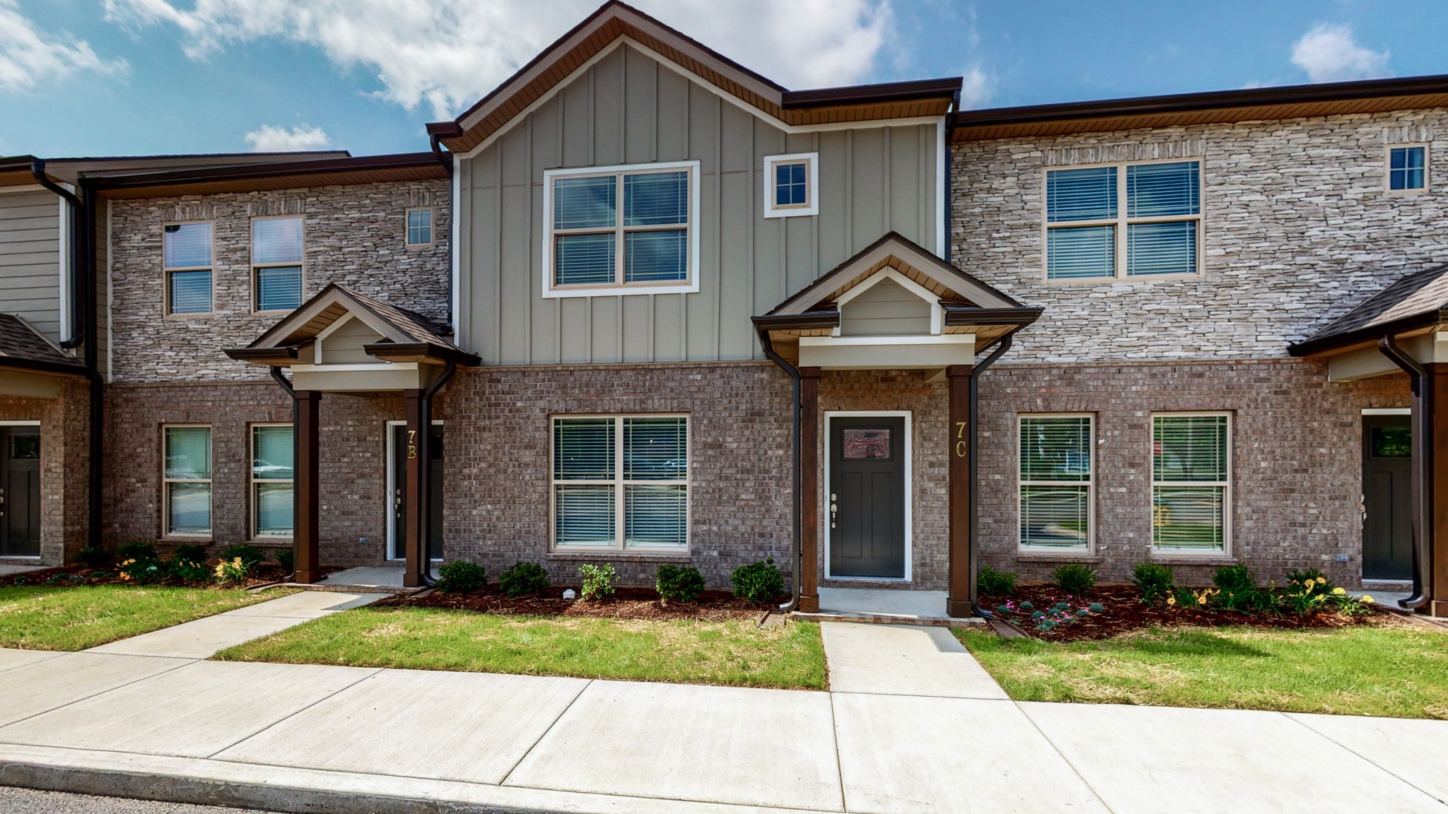 a front view of a house with garden