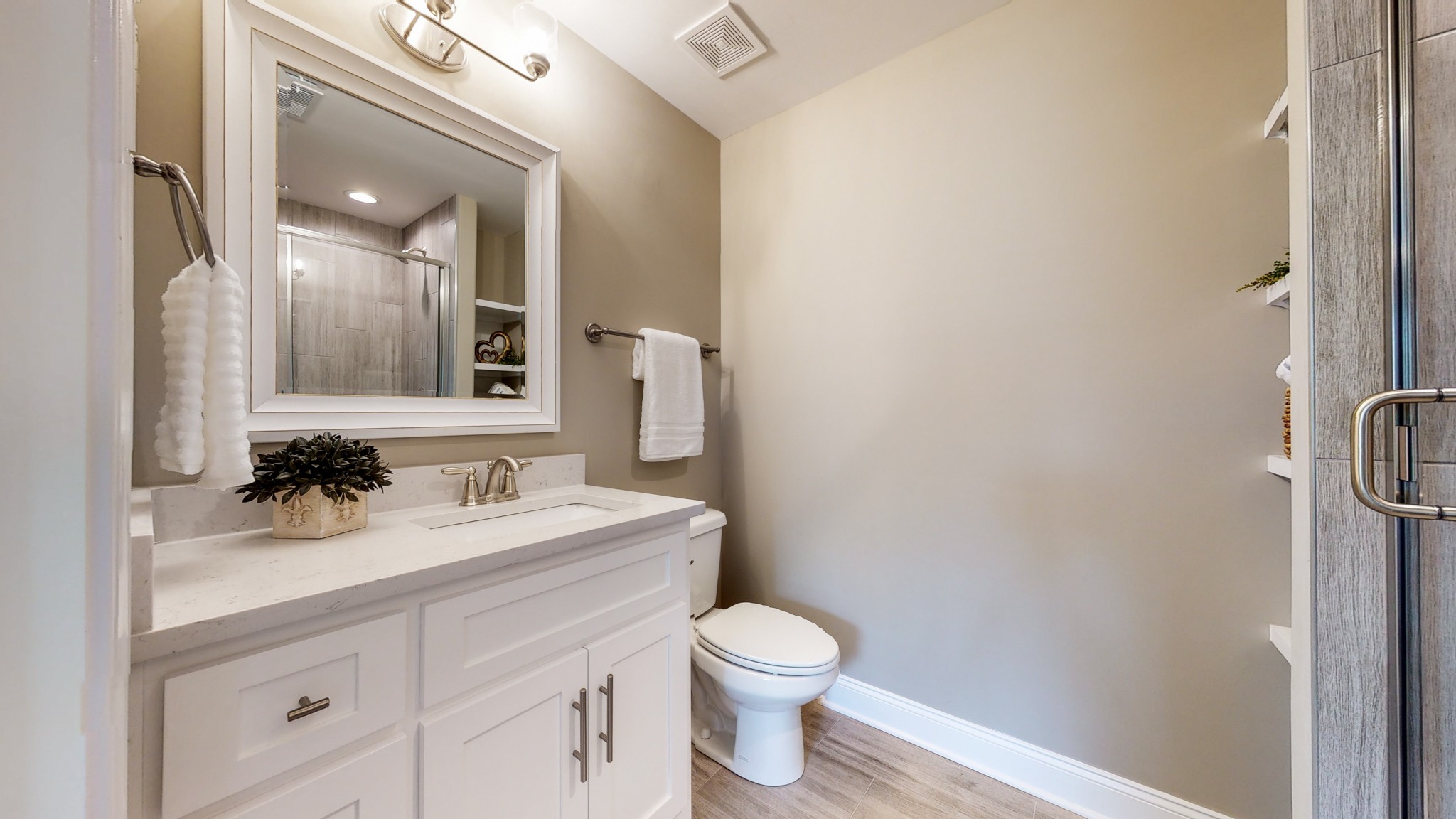 555 Gresham Lane, Unit 7C Murfreesboro, TN 37128 - Photo 12 of 19 a bathroom with a sink a toilet and mirror