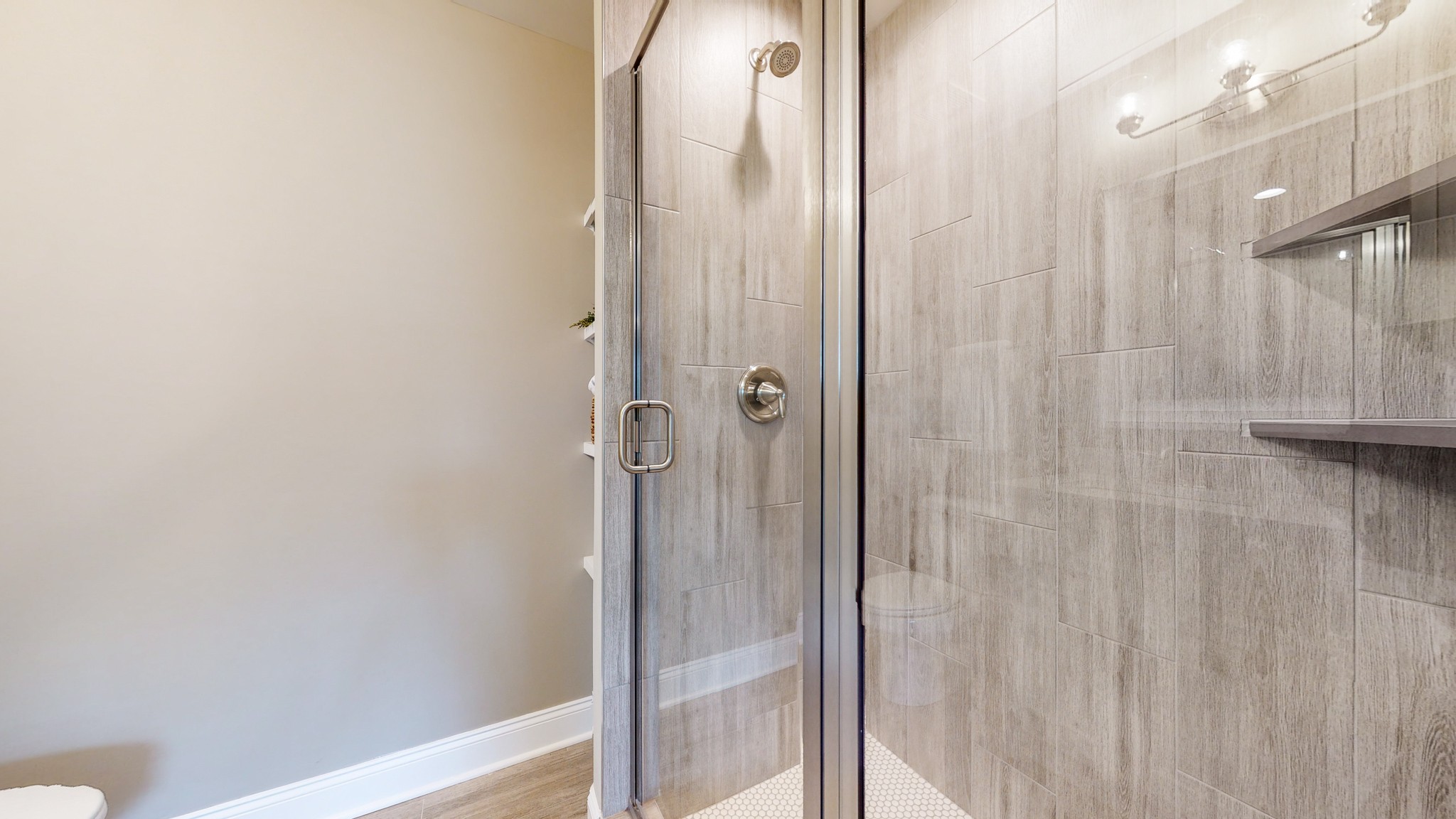 555 Gresham Lane, Unit 7C Murfreesboro, TN 37128 - Photo 13 of 19 a bathroom with a glass shower door