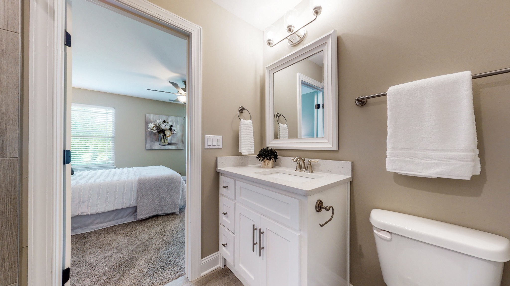 555 Gresham Lane, Unit 7C Murfreesboro, TN 37128 - Photo 14 of 19 a en suite bathroom with a toilet sink and mirror