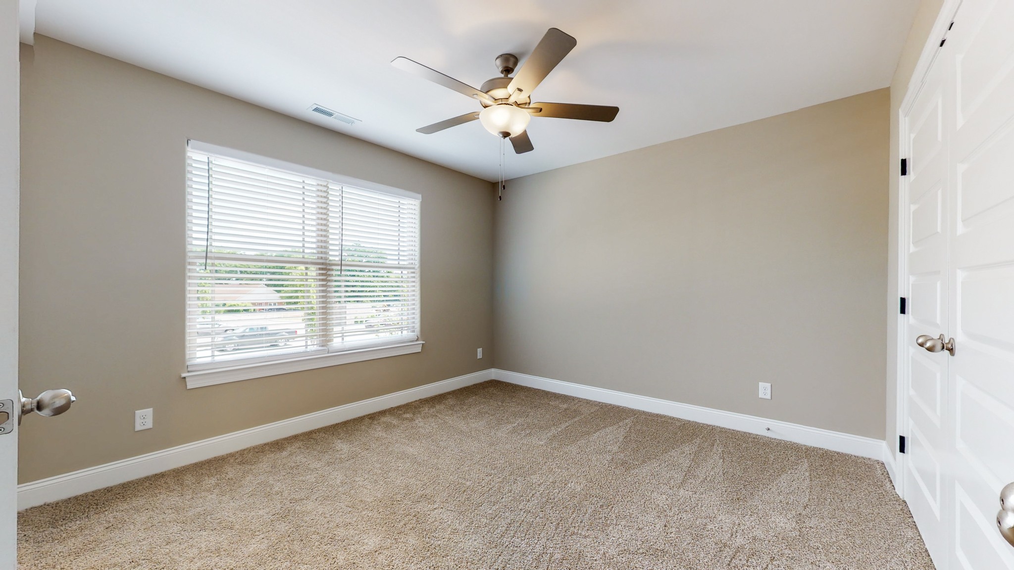 555 Gresham Lane, Unit 7C Murfreesboro, TN 37128 - Photo 15 of 19 an empty room with window and ceiling fan