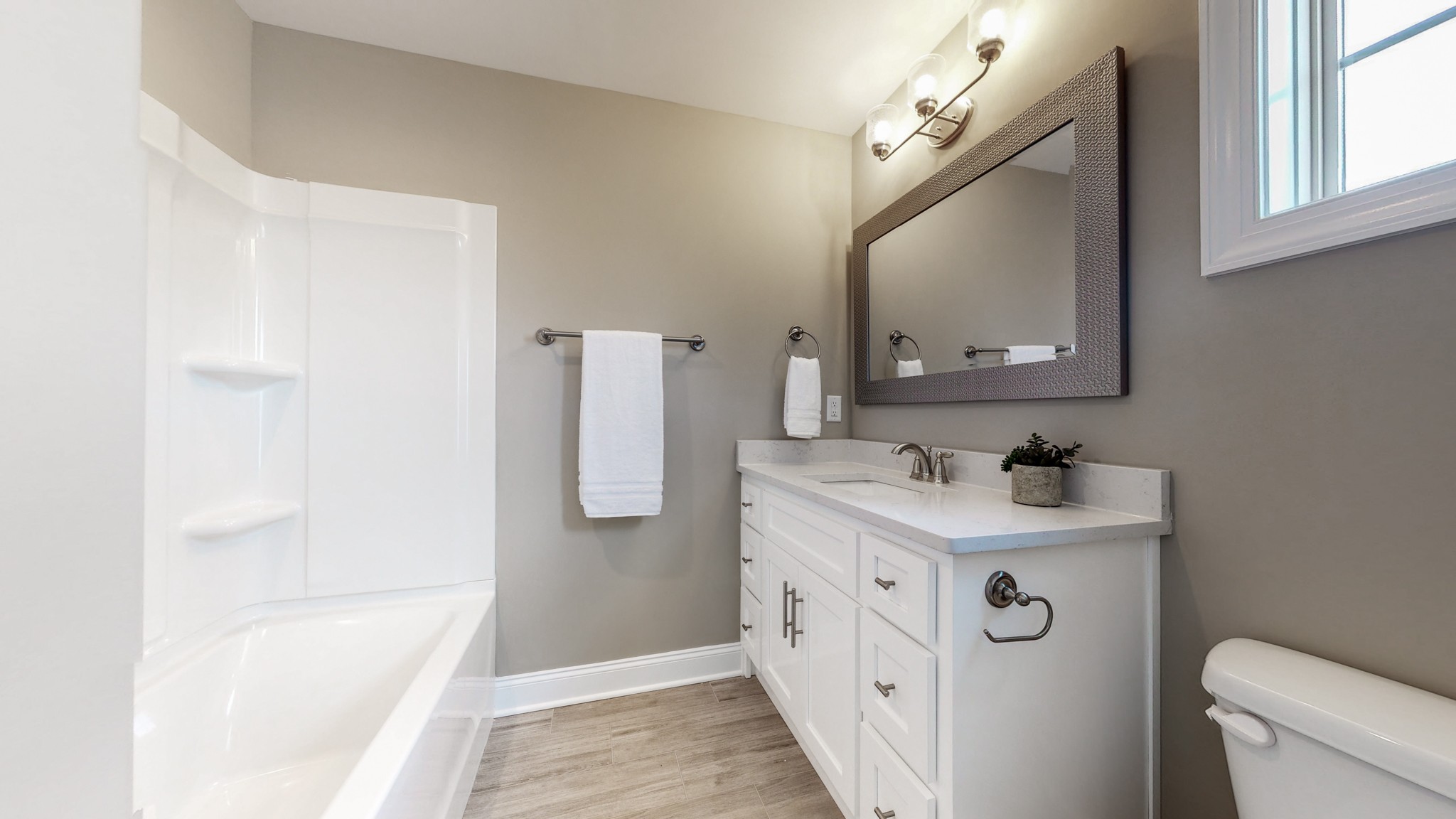555 Gresham Lane, Unit 7C Murfreesboro, TN 37128 - Photo 16 of 19 a bathroom with a sink a toilet and a mirror