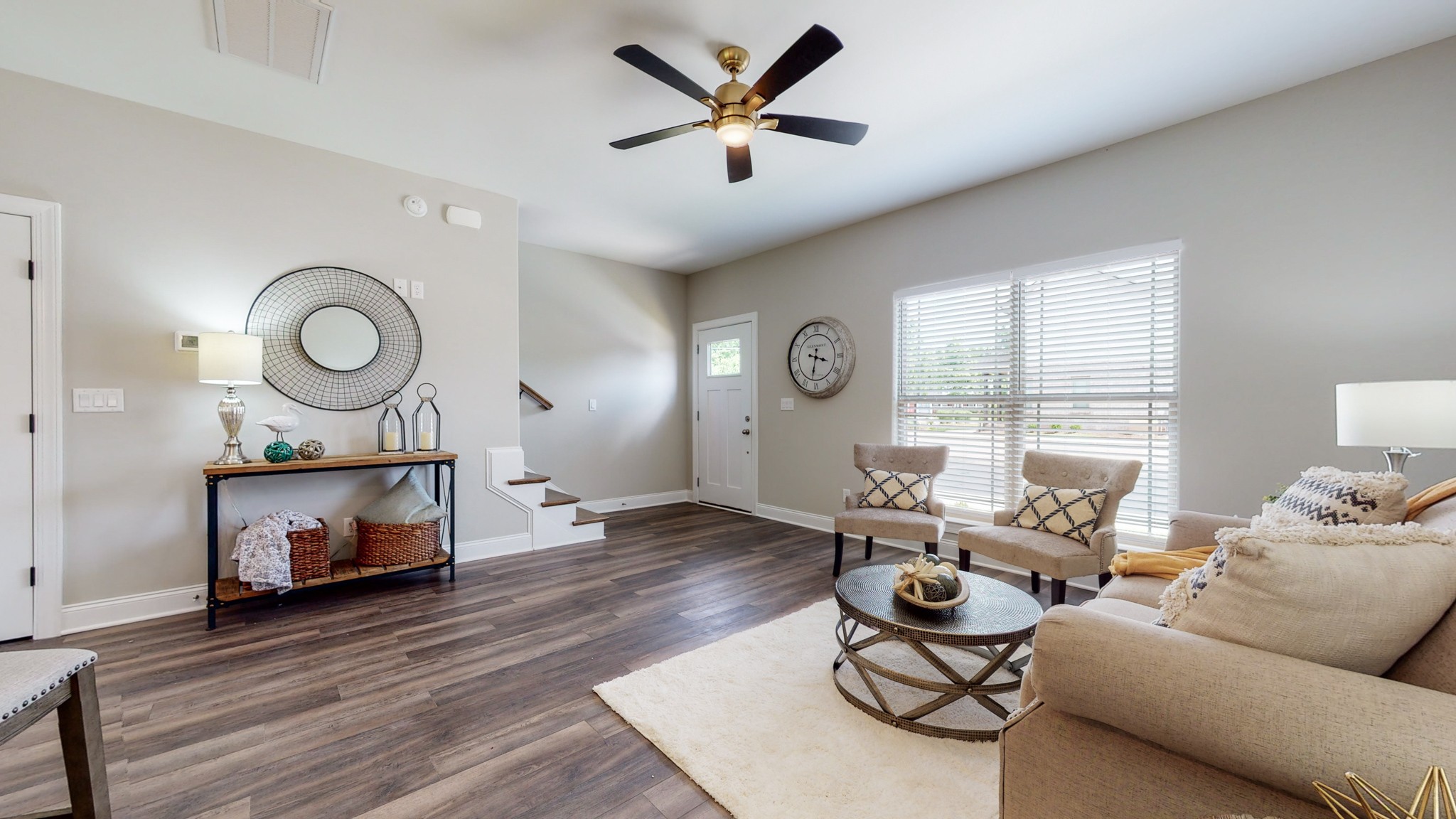 555 Gresham Lane, Unit 7C Murfreesboro, TN 37128 - Photo 5 of 19 a living room with furniture a fireplace and a large window