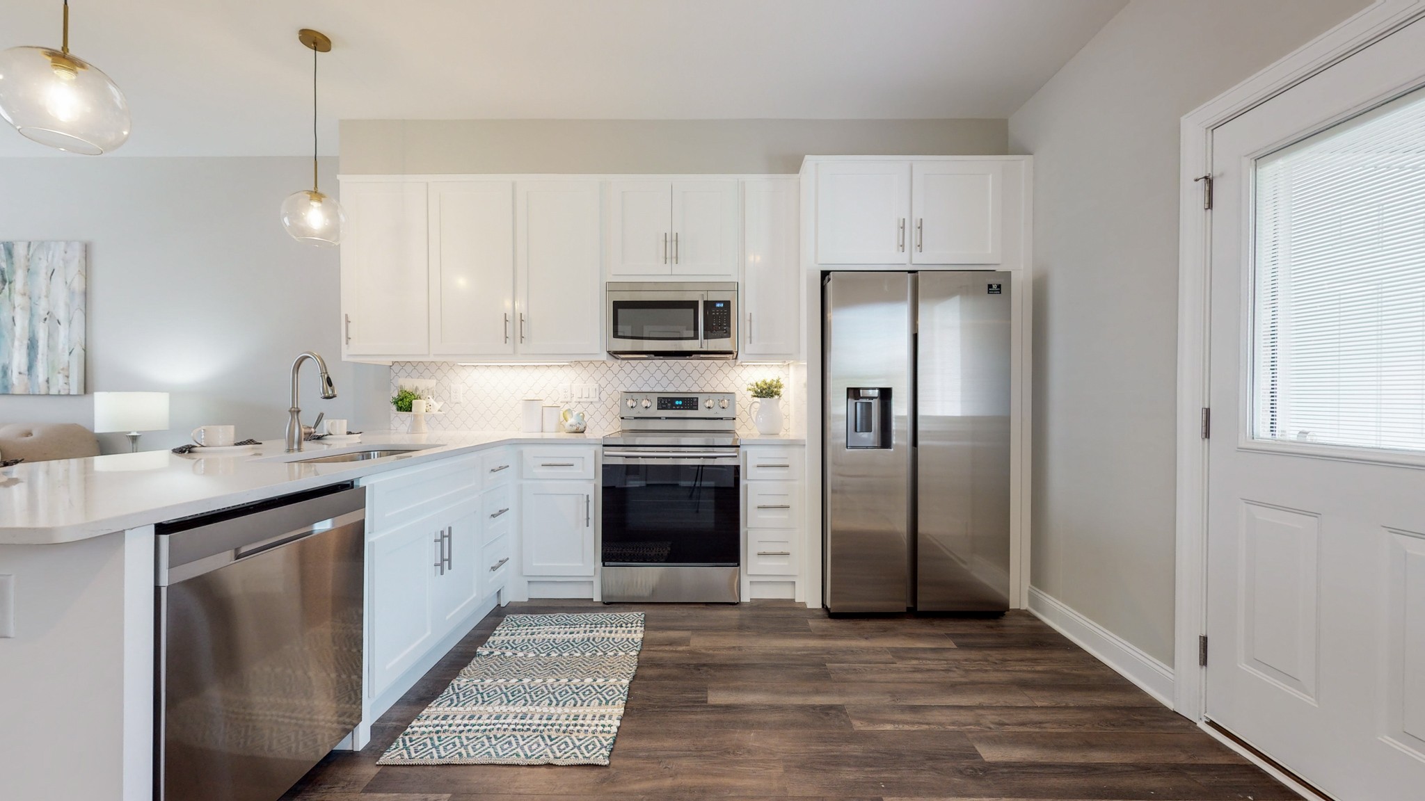 555 Gresham Lane, Unit 7C Murfreesboro, TN 37128 - Photo 8 of 19 a kitchen with kitchen island granite countertop a stove a sink and a refrigerator