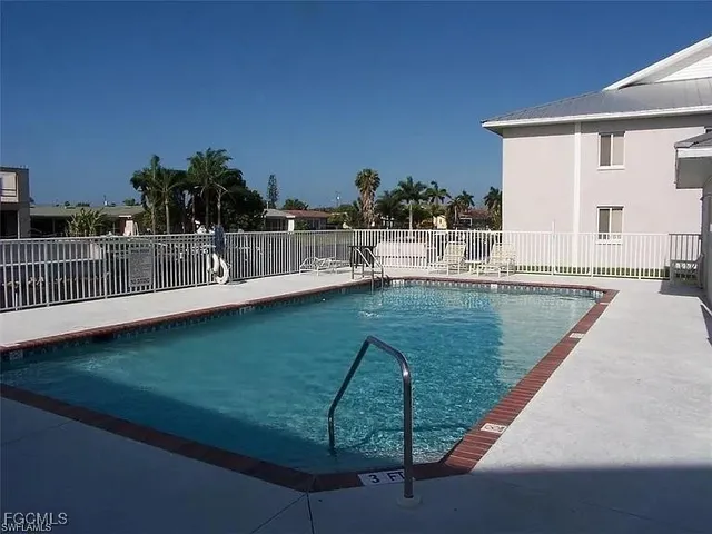 a view of a swimming pool with a patio