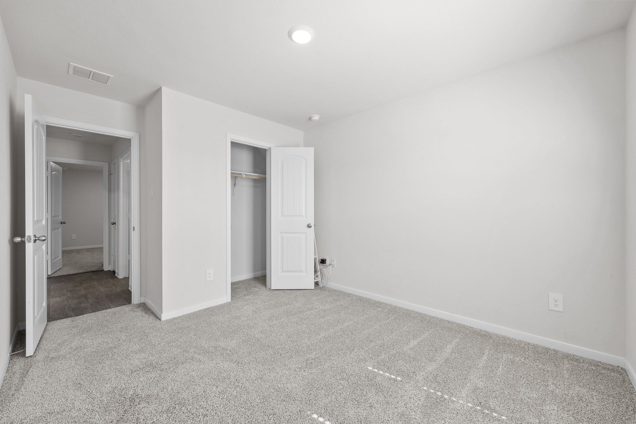 320 Darwin Place Lockhart, TX 78644 - Photo 11 of 31 Unfurnished bedroom featuring light carpet and a closet