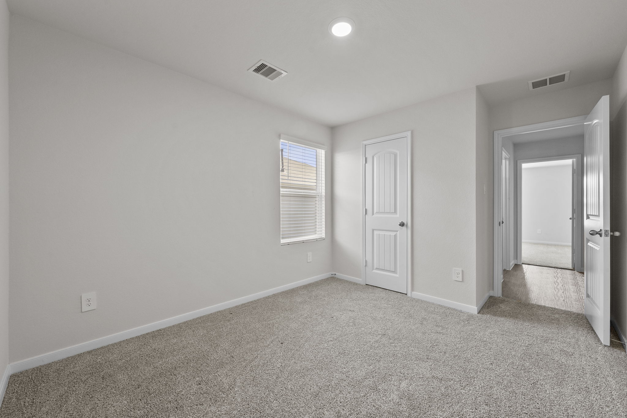 320 Darwin Place Lockhart, TX 78644 - Photo 13 of 31 Unfurnished bedroom featuring light colored carpet, a closet, and recessed lighting