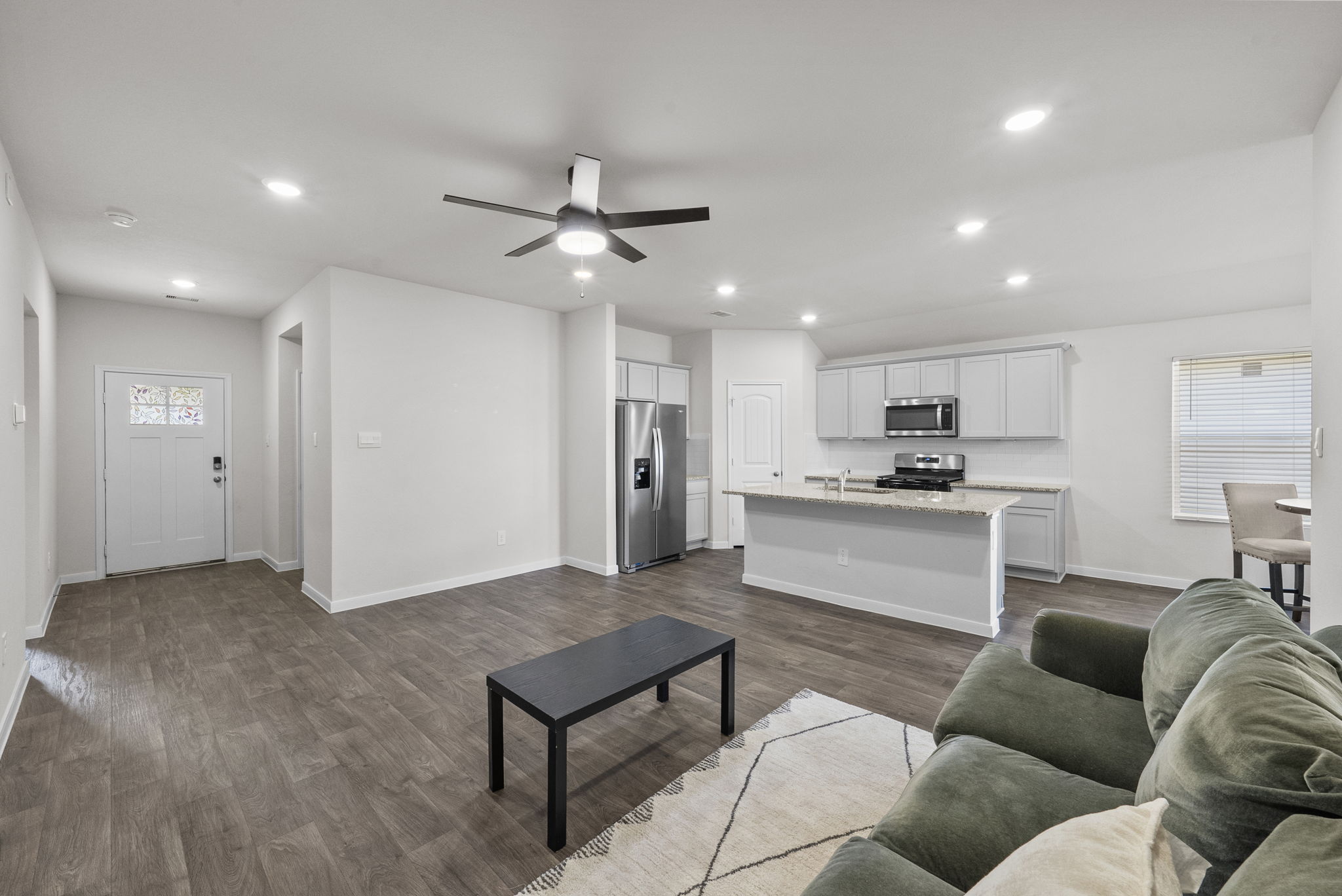 320 Darwin Place Lockhart, TX 78644 - Photo 14 of 31 Living area with dark wood-style floors, ceiling fan, and recessed lighting