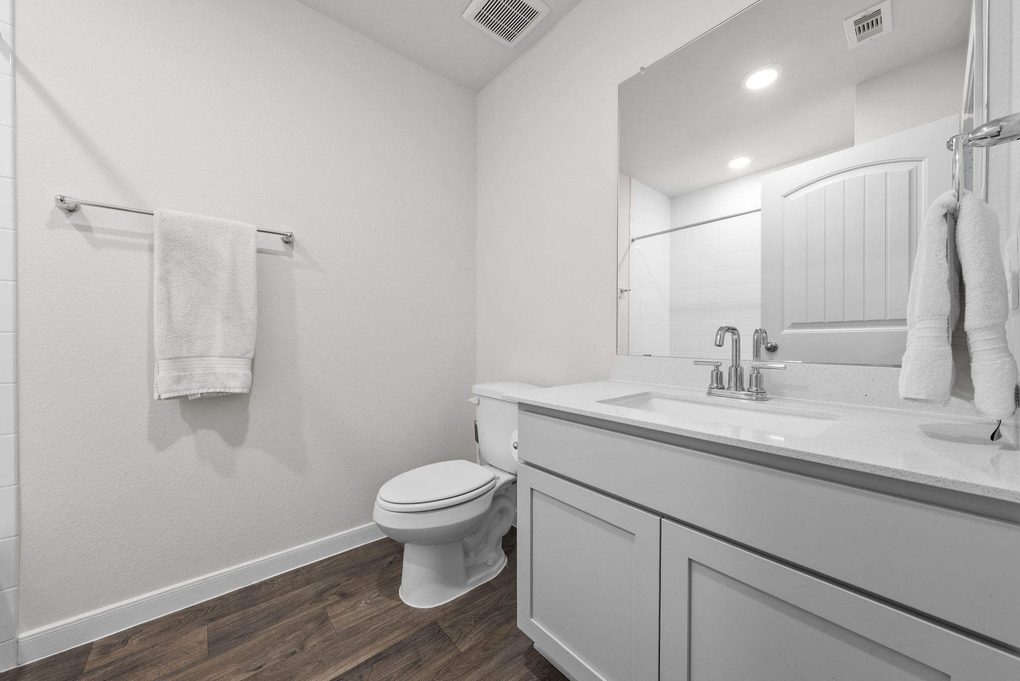 320 Darwin Place Lockhart, TX 78644 - Photo 15 of 31 Full bathroom with vanity, dark wood-style flooring, and a shower