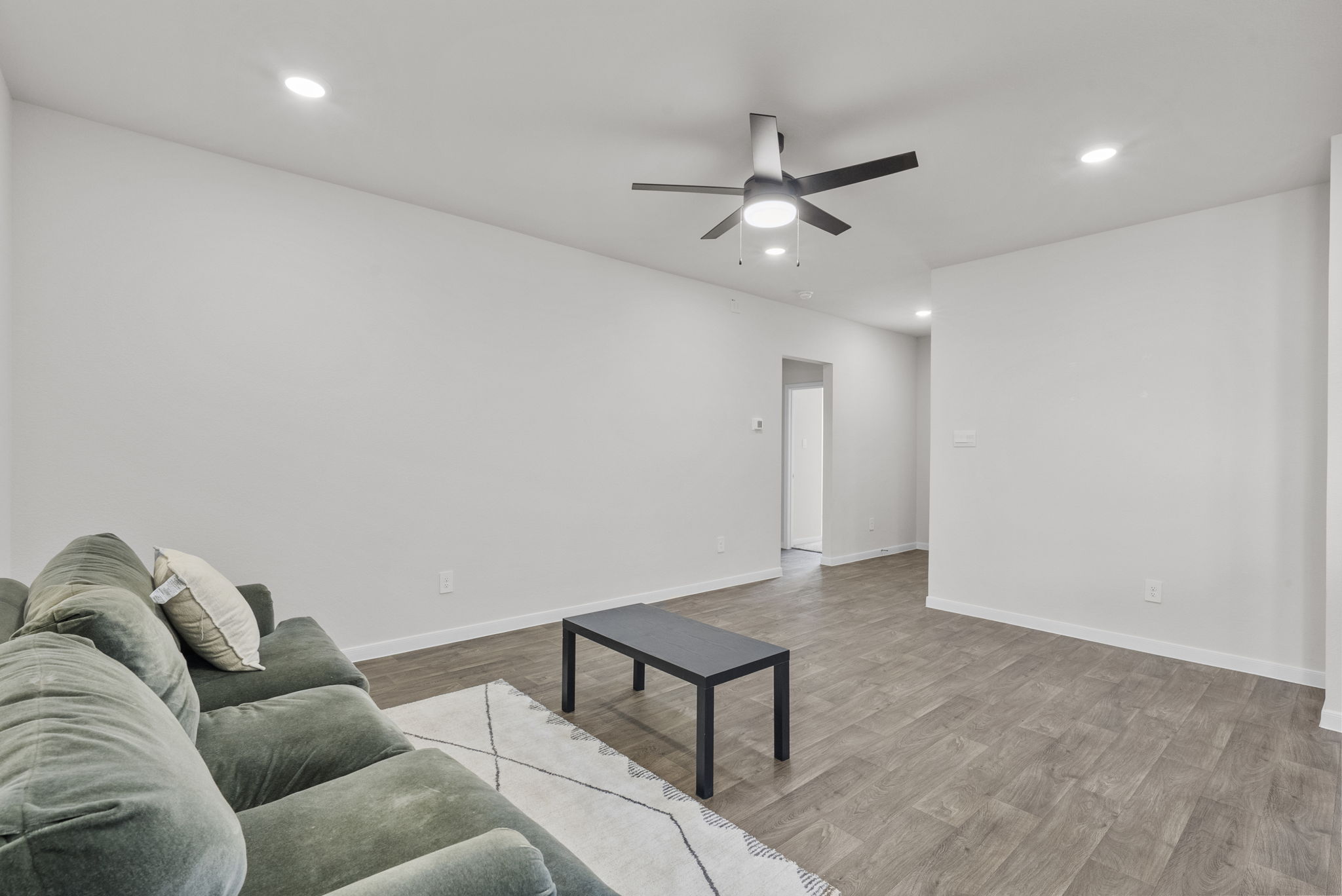 320 Darwin Place Lockhart, TX 78644 - Photo 17 of 31 Living room with light wood-style flooring, recessed lighting, and a ceiling fan
