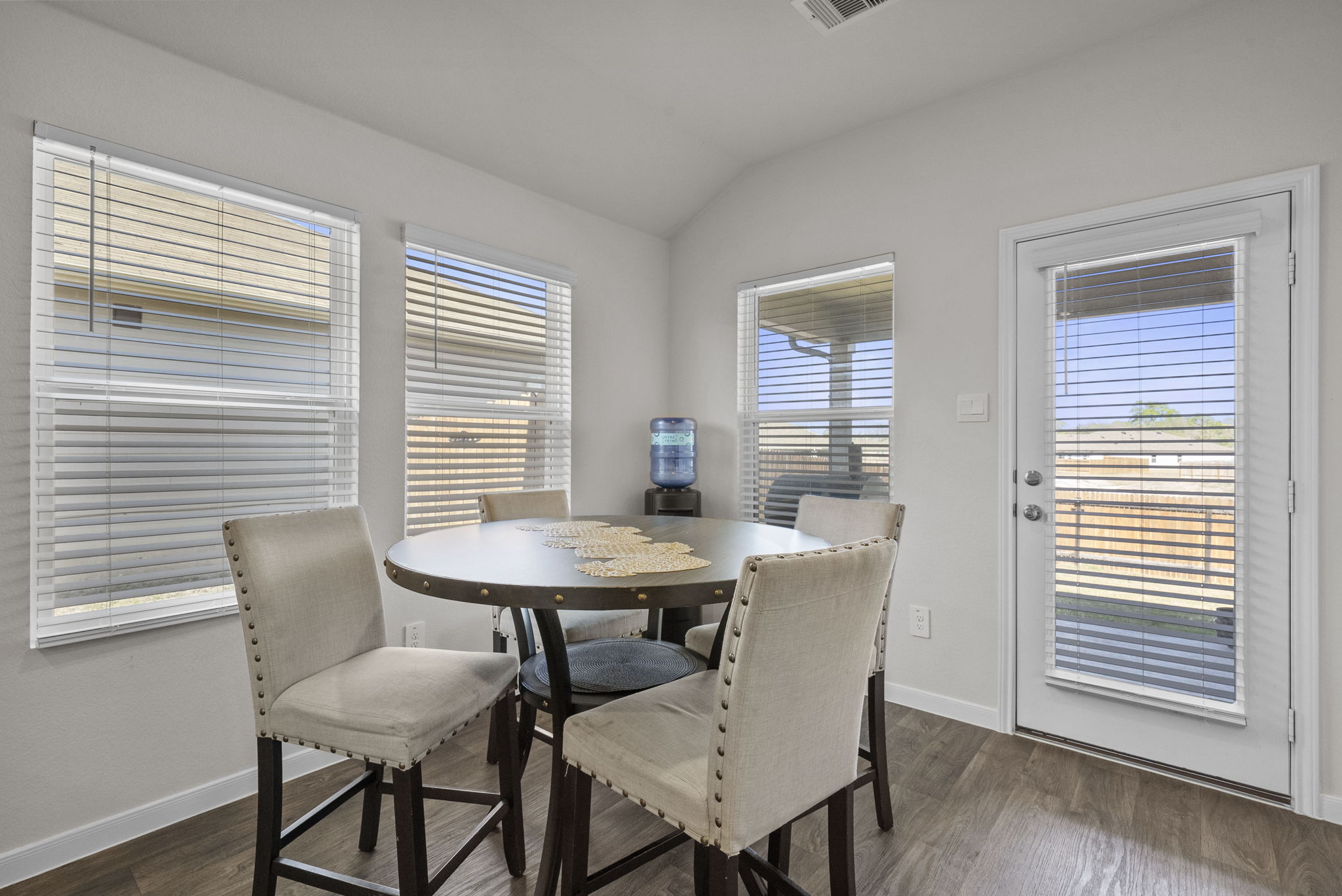320 Darwin Place Lockhart, TX 78644 - Photo 20 of 31 Dining room featuring dark wood finished floors and lofted ceiling