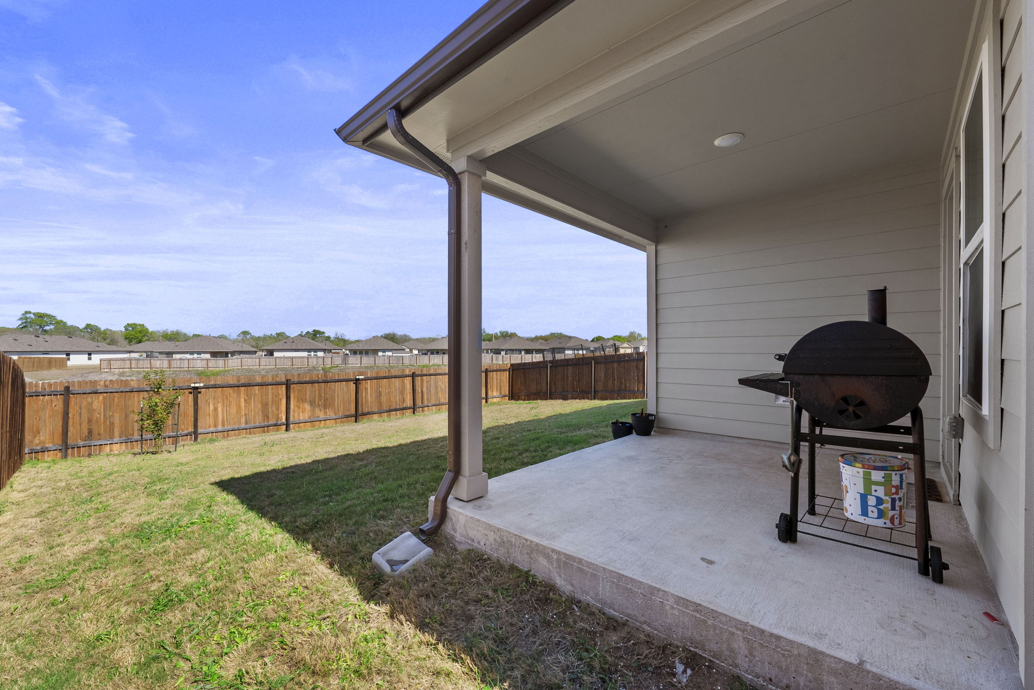 320 Darwin Place Lockhart, TX 78644 - Photo 30 of 31 Fenced backyard with a patio