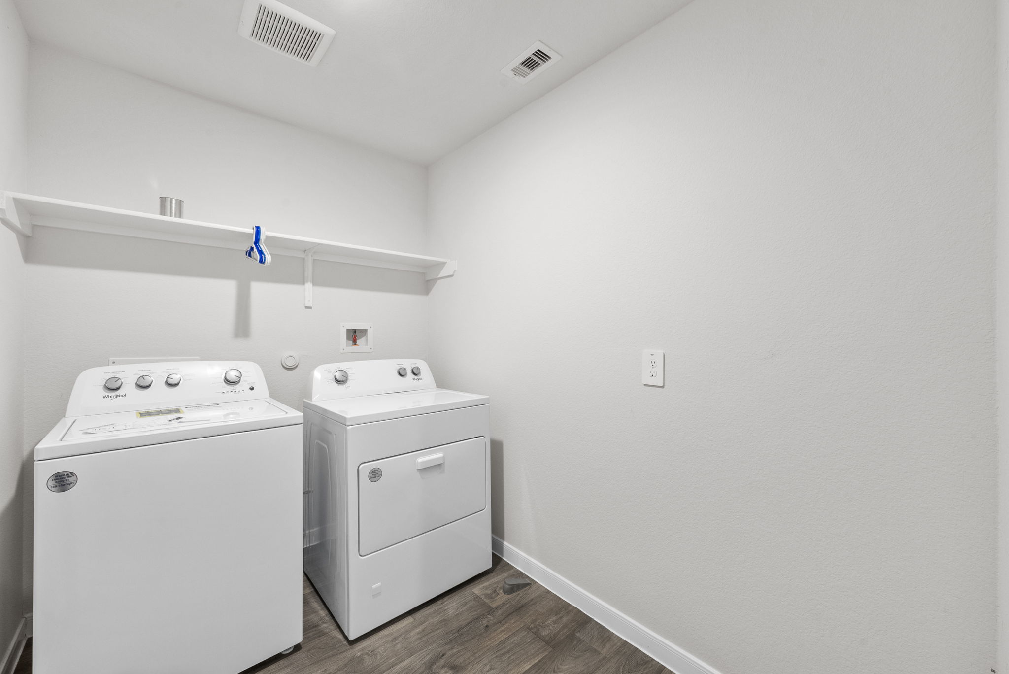 320 Darwin Place Lockhart, TX 78644 - Photo 5 of 31 Laundry area with dark wood-style floors and washer and dryer