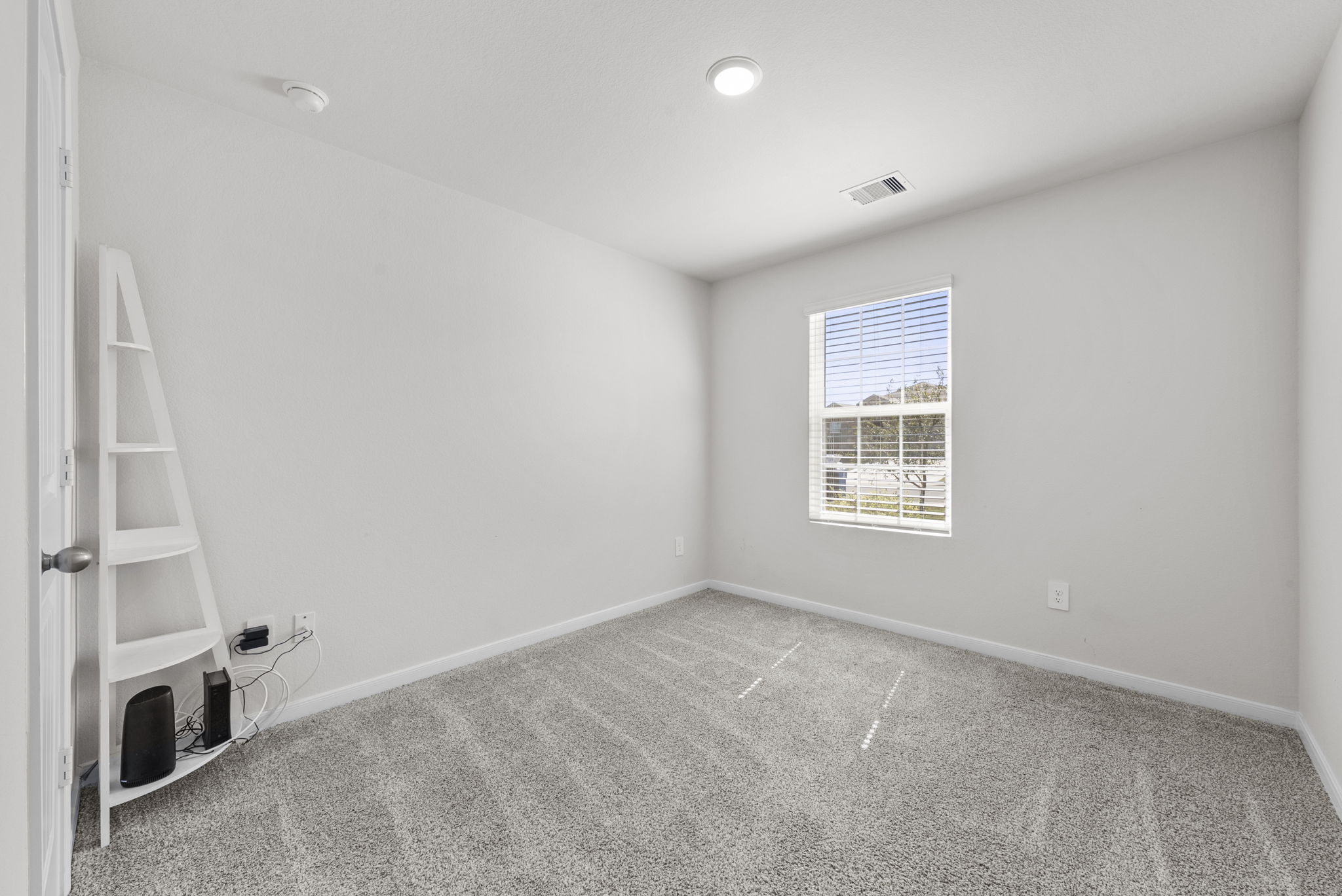 320 Darwin Place Lockhart, TX 78644 - Photo 10 of 31 Unfurnished room featuring light carpet and baseboards