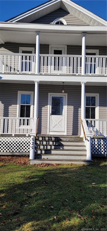 525 Prospect Street, Unit 2 Torrington, CT 06790 - Photo 1 of 1 a front view of a house with a garden