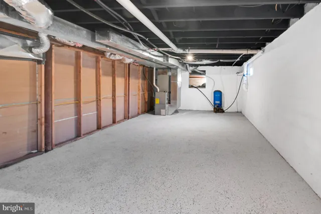 a view of empty room with wooden walls