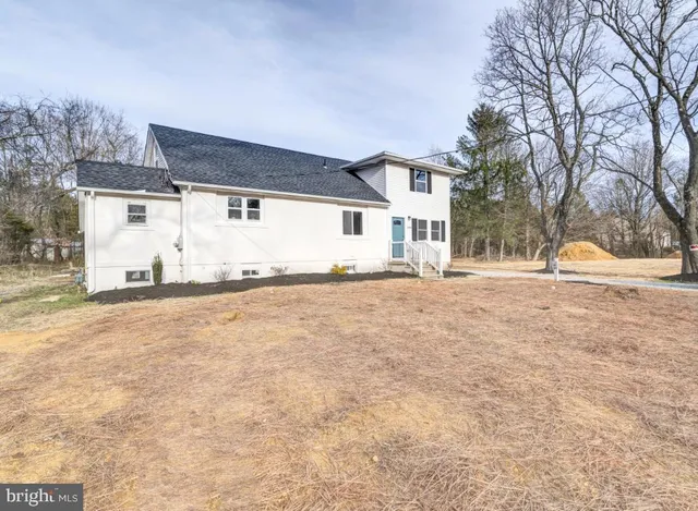 a view of a house with snow on the road