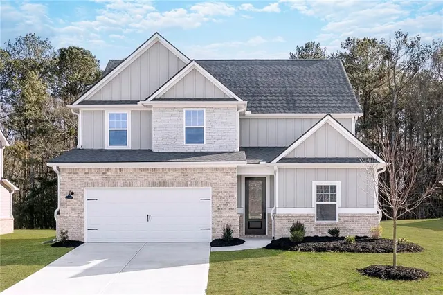 a view of a yard in front view of a house