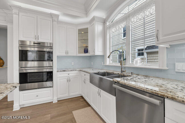 Undisclosed Address Spring Lake, NJ 07762 - Photo 20 of 67 a kitchen with stainless steel appliances granite countertop a stove and a sink