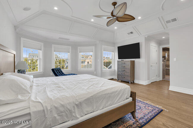 Undisclosed Address Spring Lake, NJ 07762 - Photo 24 of 67 a spacious bedroom with a bed and a flat screen tv