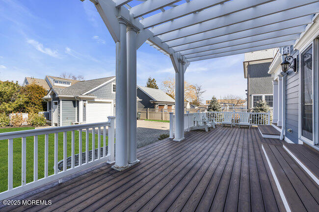 Undisclosed Address Spring Lake, NJ 07762 - Photo 3 of 67 a view of a balcony with wooden floor