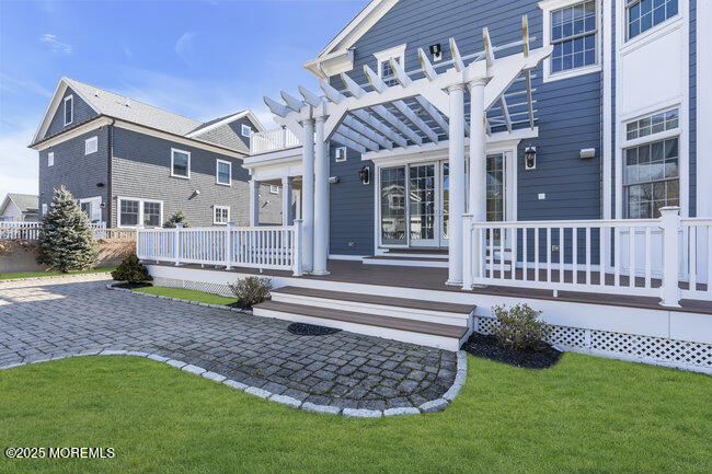 Undisclosed Address Spring Lake, NJ 07762 - Photo 4 of 67 a view of a house with a yard and deck