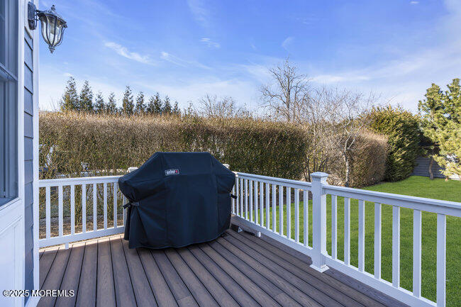 Undisclosed Address Spring Lake, NJ 07762 - Photo 52 of 67 a view of balcony with wooden floor and fence