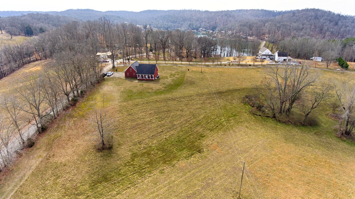 168 Lake Logan Road Ardmore, TN 38449 - Photo 2 of 27 a view of lake with mountain