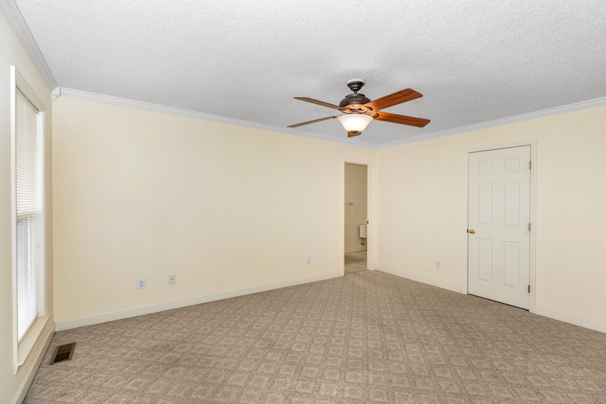 168 Lake Logan Road Ardmore, TN 38449 - Photo 11 of 27 a view of a room with a ceiling fan and a window