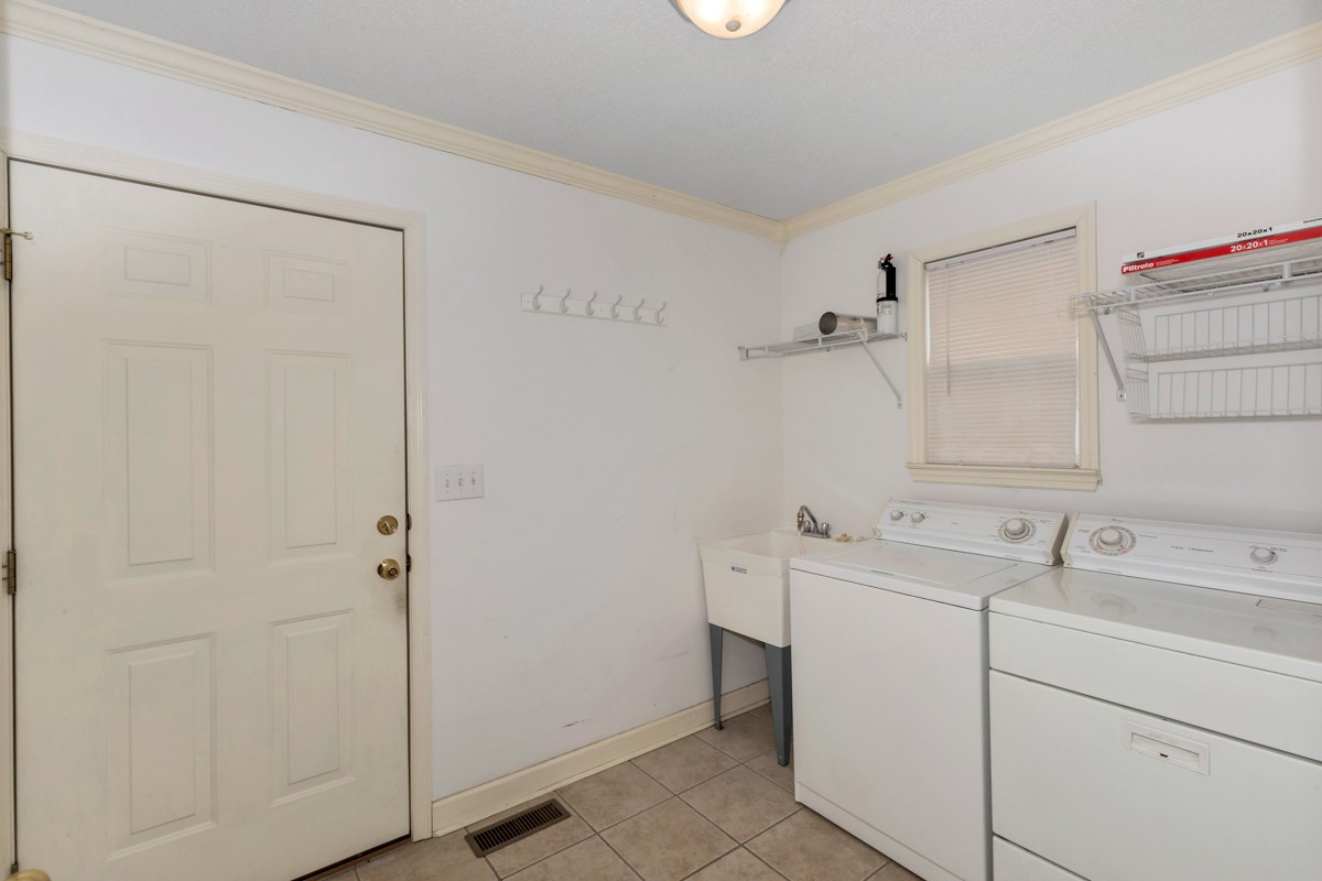168 Lake Logan Road Ardmore, TN 38449 - Photo 16 of 27 a utility room with dryer and washer