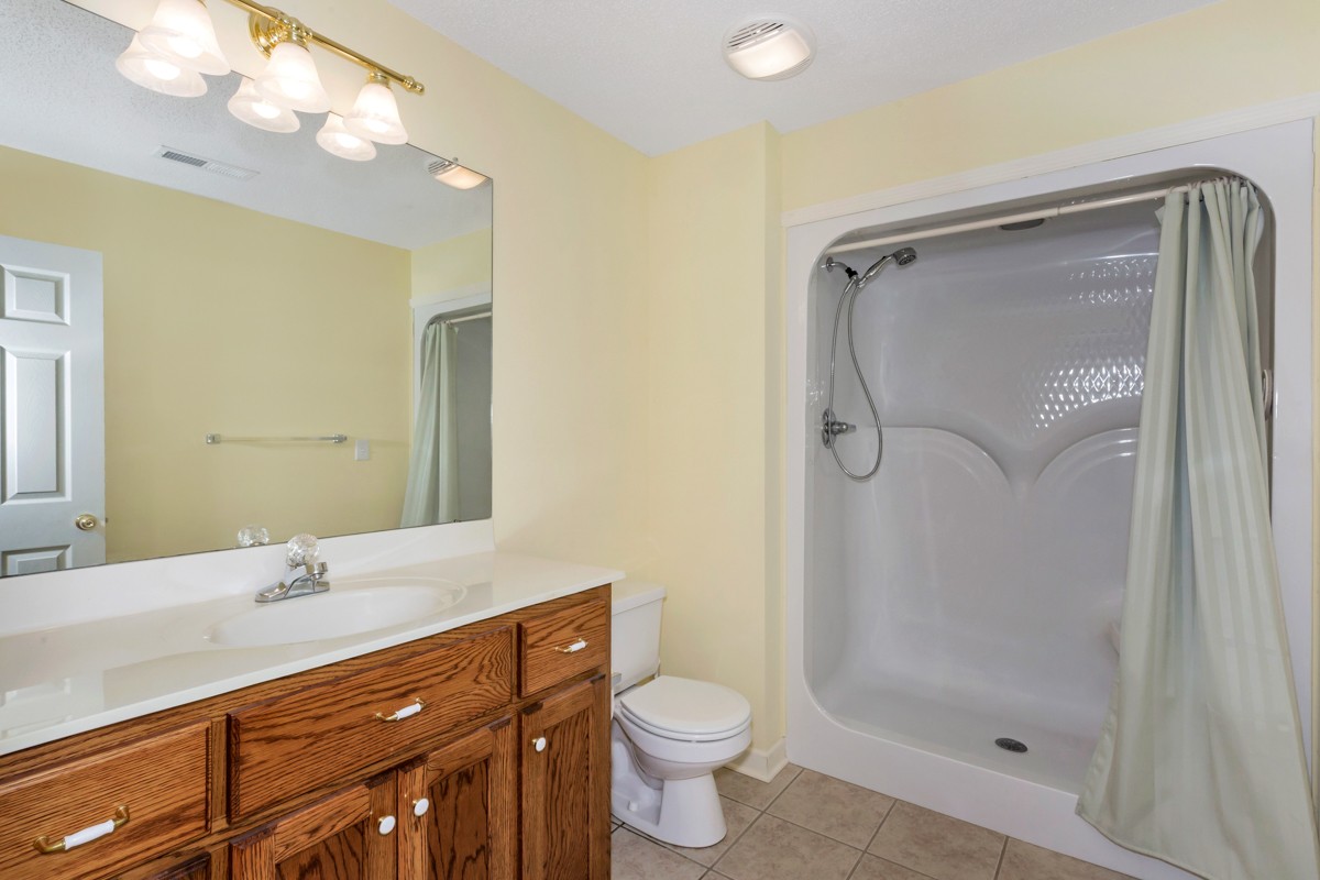 168 Lake Logan Road Ardmore, TN 38449 - Photo 21 of 27 a bathroom with a double vanity sink mirror and toilet